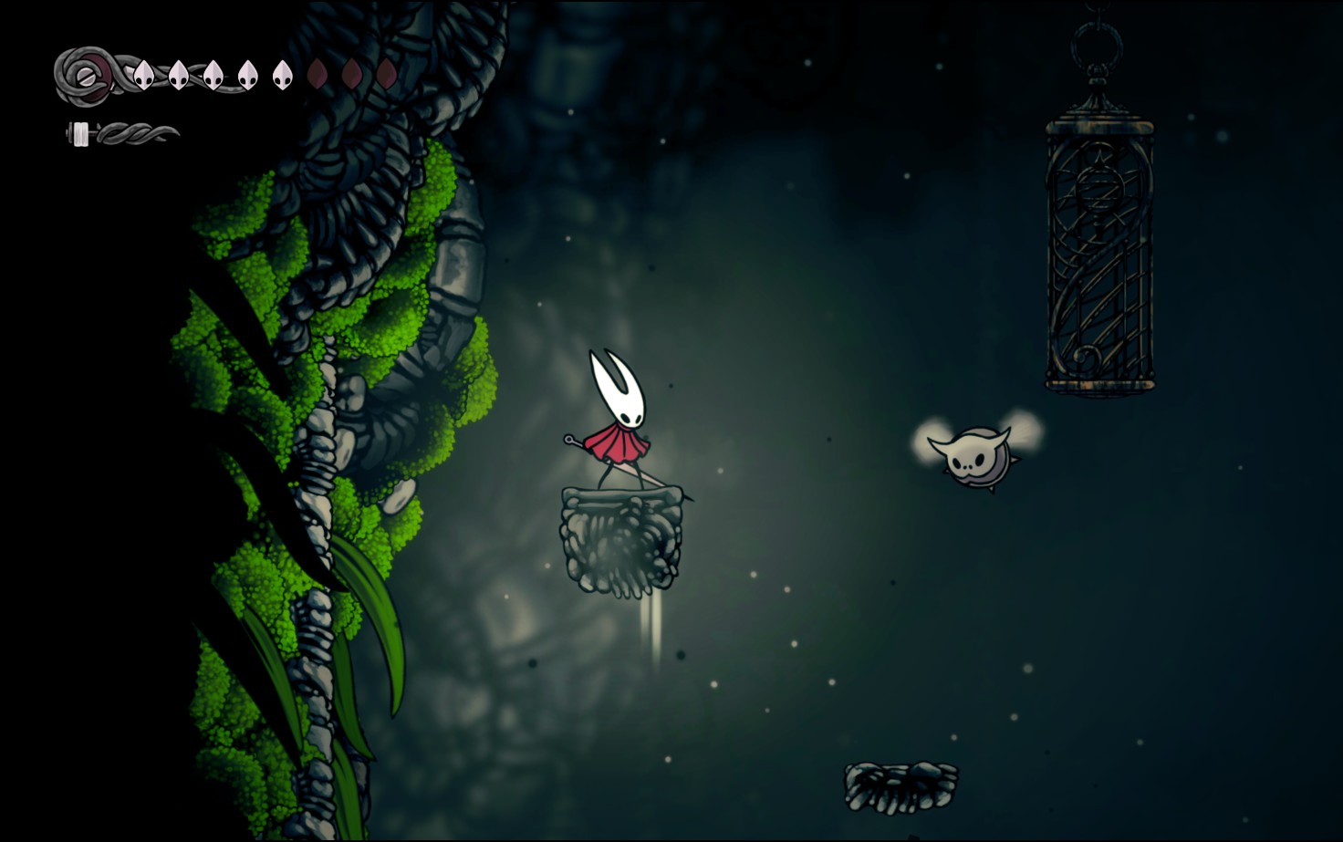 An early game skip, where the player can jump on an enemy to bypass needing the wall jump ability. Screenshot by the author. Hornet is standing on a stone platform while a flying enemy hovers toward her.